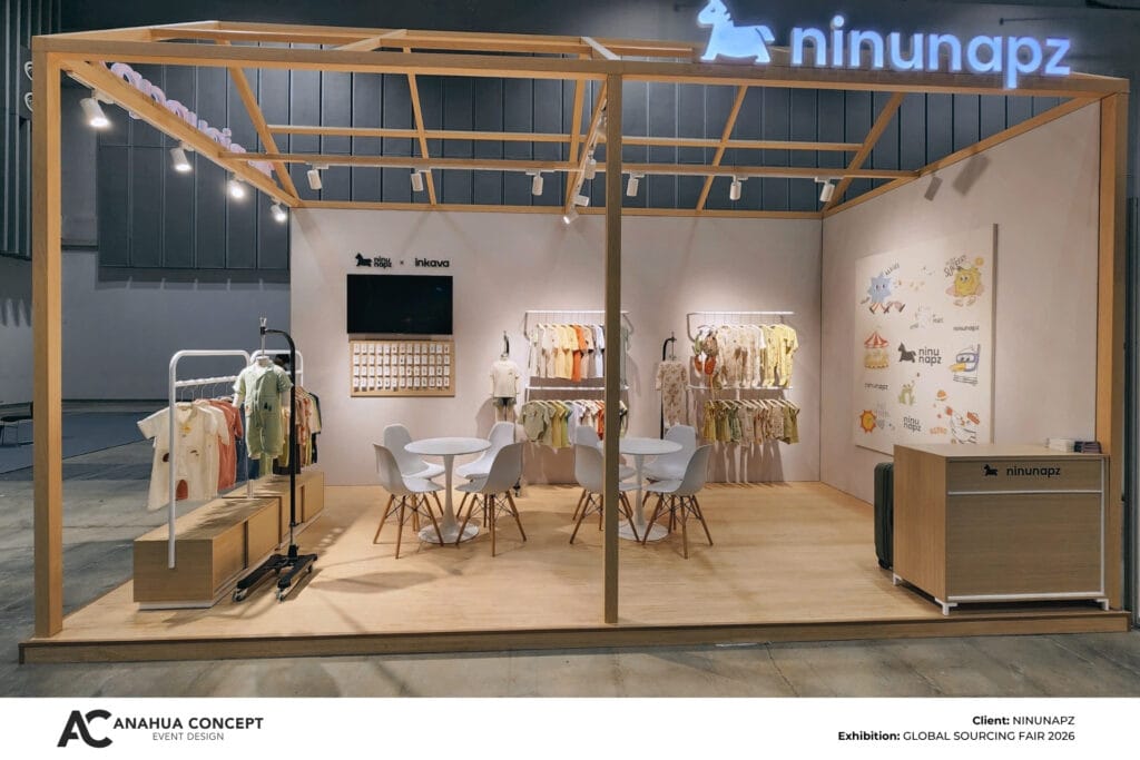 Close-up of a professional fashion booth construction with meticulous wooden finishing and UV-printed fabric panels