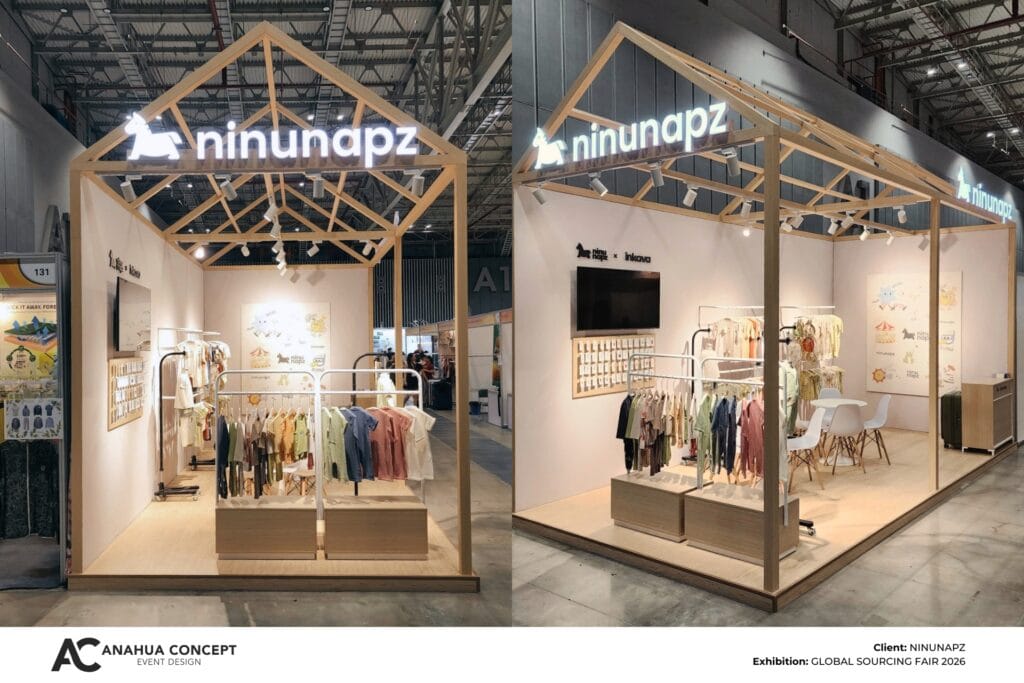 Minimalist children's fashion exhibition booth for Ninunapz featuring a rustic wooden house-frame structure