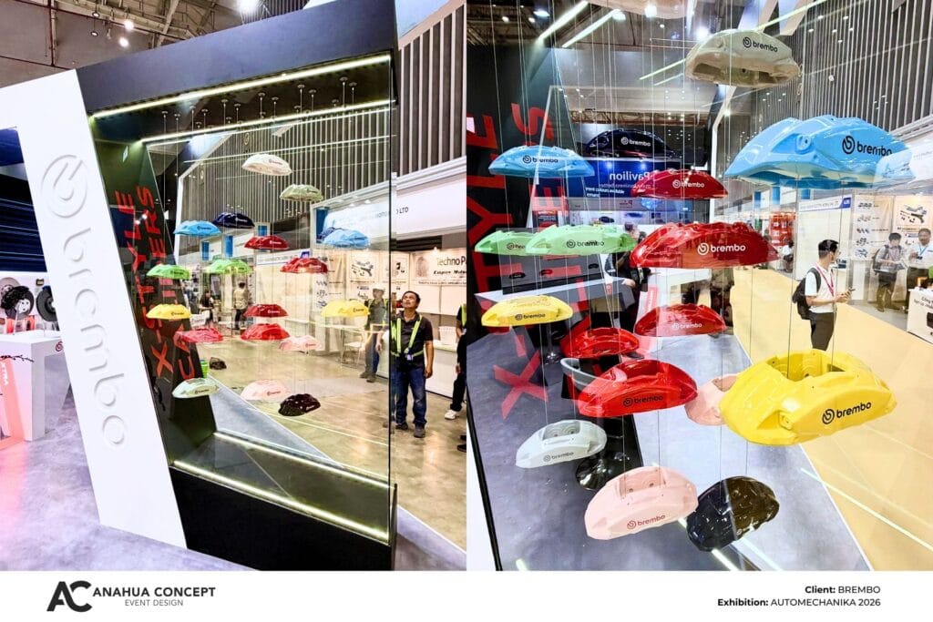 Exhibition space featuring glass walls and display showcases at the Brembo booth